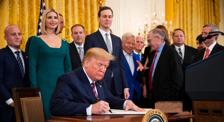 President Donald Trump signs an executive order combatting anti-Semitism in the U. S. during a Hanukkah reception in the East Room of the White House Wednesday, Dec. 11, 2019, in Washington. President Donald Trump signs an executive order combatting anti-Semitism in the U. S. during a Hanukkah reception in the East Room of the White House Wednesday, Dec. 11, 2019, in Washington.