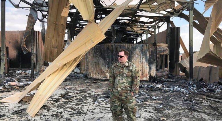 A U.S. soldier stands at a site of Iranian bombing, in Ain al-Asad air base, Anbar, Iraq, Monday, Jan. 13, 2020.