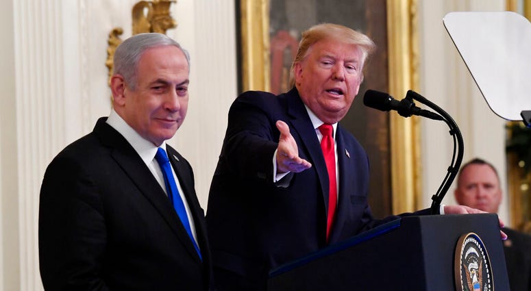 President Donald Trump speaks during an event with Israeli Prime Minister Benjamin Netanyahu in the East Room of the White House in Washington, Tuesday, Jan. 28, 2020. ( President Donald Trump speaks during an event with Israeli Prime Minister Benjamin Netanyahu in the East Room of the White House in Washington, Tuesday, Jan. 28, 2020. (