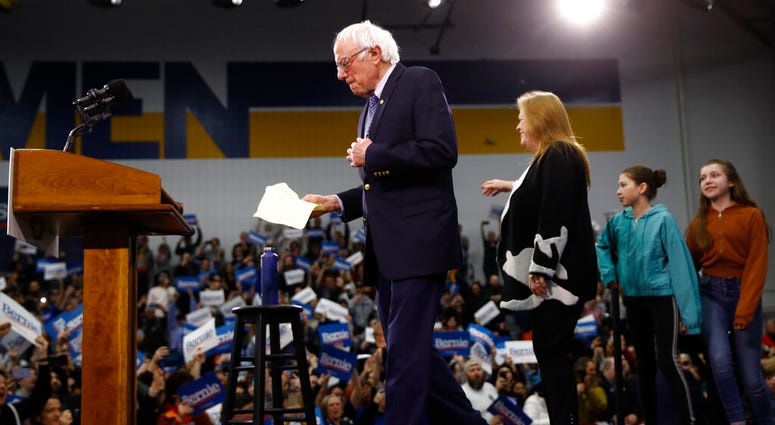 Democratic presidential candidate Sen. Bernie Sanders, I-Vt., arrives to speak to supporters at a primary night election rally in Manchester, N.H., Tuesday, Feb. 11, 2020.