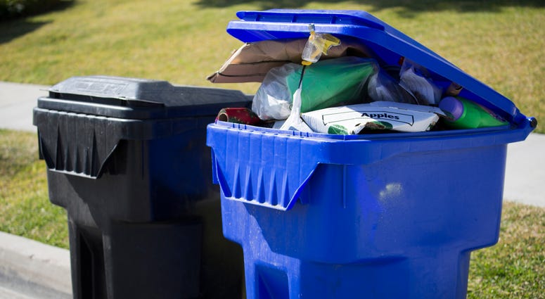 Recycling bin filled to the top