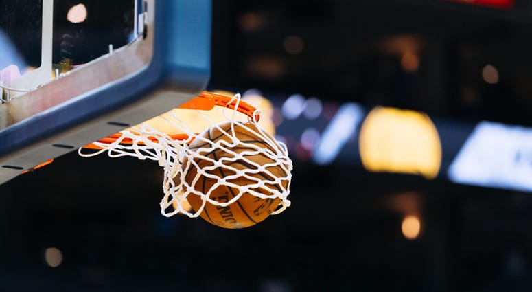 A basketball player makes a basket A basketball player makes a basket