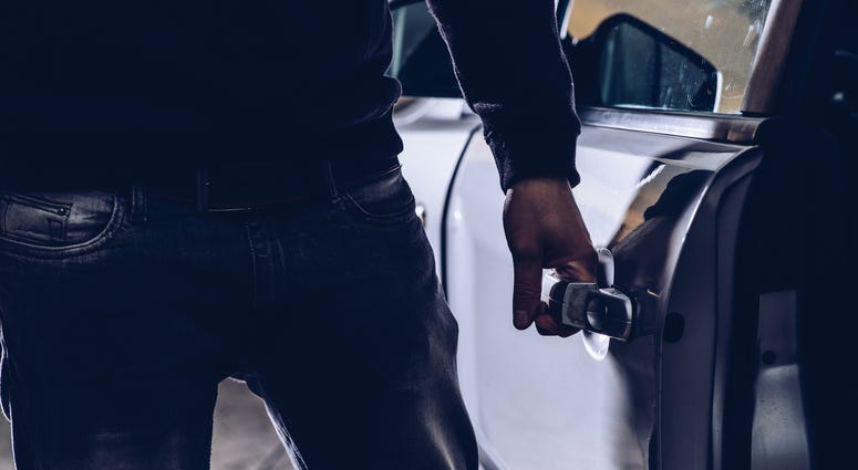 Man breaking into a car