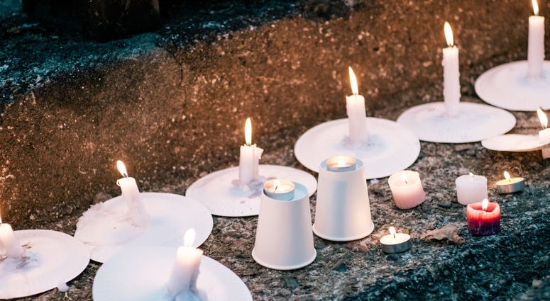 Candles are lit as people attend a vigil for the lives taken in the Christchurch terror attacks at the Auckland Domain on March 22, 2019 in Auckland, New Zealand.