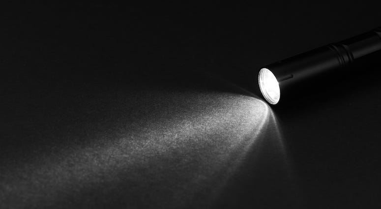 Flashlight and beam of light on a dark background Flashlight and beam of light on a dark background