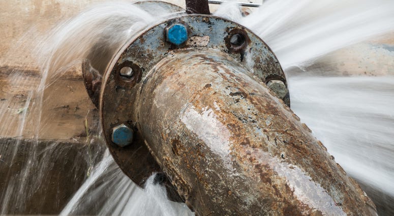 metal pipe with valve is leaking in water treatment plant metal pipe with valve is leaking in water treatment plant