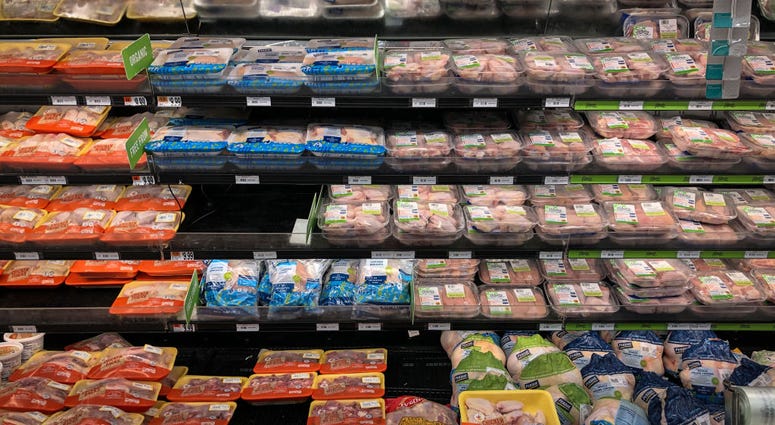 A view of the chicken and meat section at a grocery store A view of the chicken and meat section at a grocery store