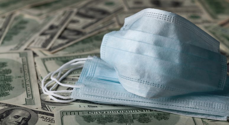 edical face mask and dollar banknotes, world coronavirus epidemic and economic losses concept edical face mask and dollar banknotes, world coronavirus epidemic and economic losses concept