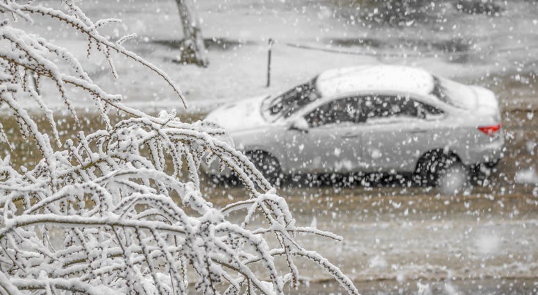 car on road with snow storm car on road with snow storm