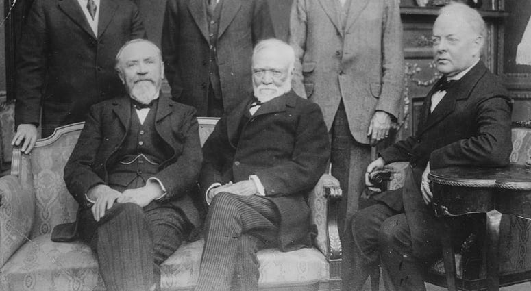 Portrait of industrialist Andrew Carnegie (centre, seated) and a group of his associated, circa 1900. (Photo by Keystone/Hulton Archive/Getty Images) DO NOT USE