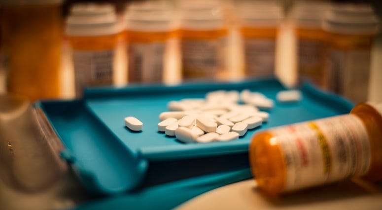 Unsorted prescription pills sit in a pharmacist's counting tray before they are bottled. Unsorted prescription pills sit in a pharmacist's counting tray before they are bottled.