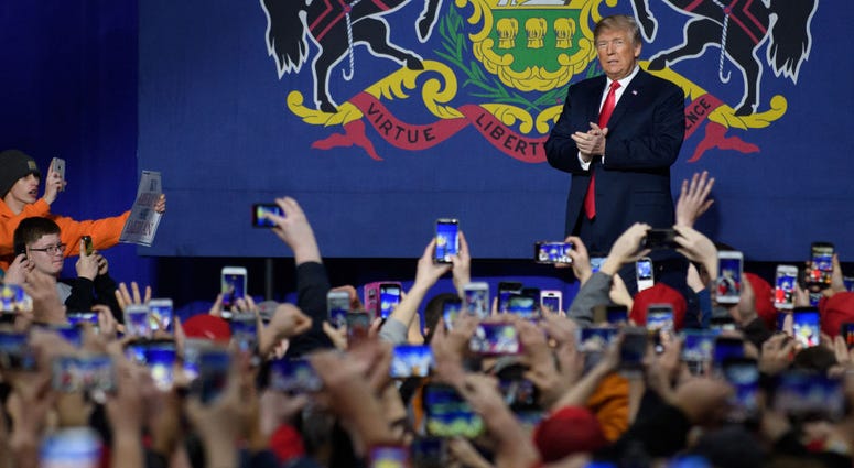 MARCH 10: President Donald J. Trump walks out to speak to supporters at the Atlantic Aviation Hanger on March 10, 2018 in Moon Township, Pennsylvania.