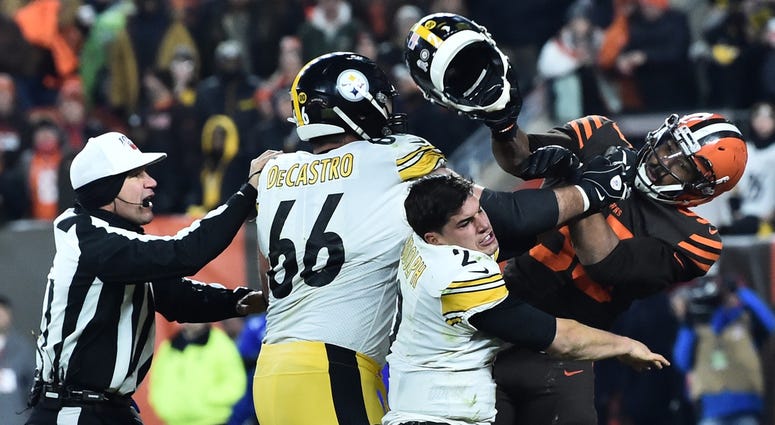 Cleveland Browns defensive end Myles Garrett (95) hits Pittsburgh Steelers quarterback Mason Rudolph Cleveland Browns defensive end Myles Garrett (95) hits Pittsburgh Steelers quarterback Mason Rudolph