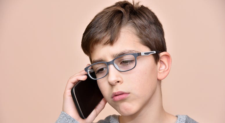 Kid with Cell Phone Kid with Cell Phone