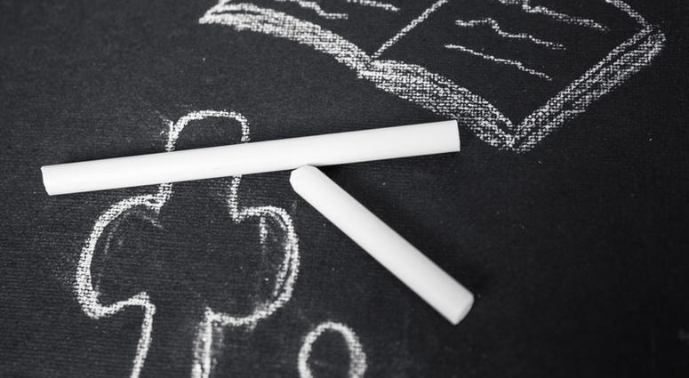 a cross on a chalk board