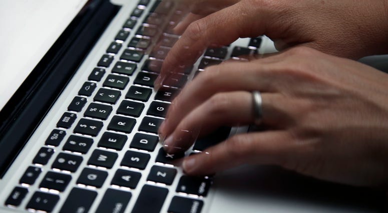 a person working on a laptop a person working on a laptop