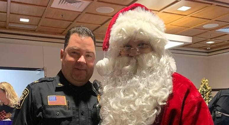 One of Bridgeville's officers with Santa Bridgeville Police Department Shop with a Cop