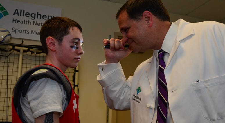 Allegheny Health Network's Dr. Ed Snell Examines a patient Allegheny Health Network's Dr. Ed Snell Examines a patient