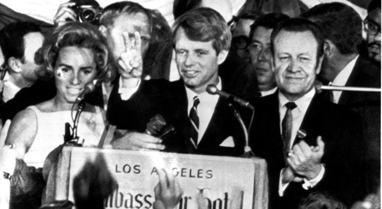U.S. Sen. Robert F. Kennedy, D-NY, speaks to campaign workers, June 5, 1968, as his wife Ethel, left, and California campaign manager and speaker of the California Assembly, Jesse Unruh, look on, at the Ambassador Hotel in Los Angeles. After making a sho DO NOT USE