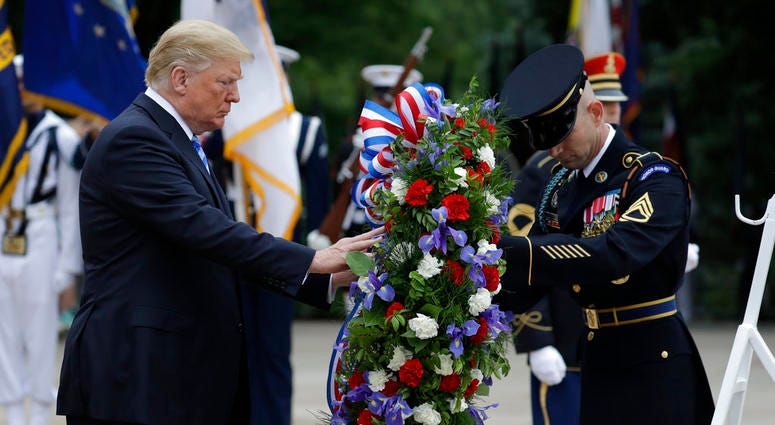 President Donald Trump lays a wreath at the Tomb of the Unknown Solider at Arlington National Cemetery, Monday, May 28, 2018 President Trump