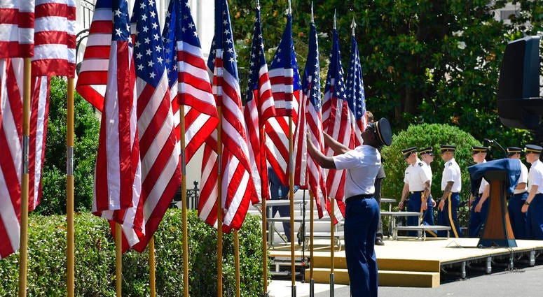 embers of an honor guard prepare flags for a "Celebration of America" event with President Donald Trump on the South Lawn of the White House in Washington DO NOT USE