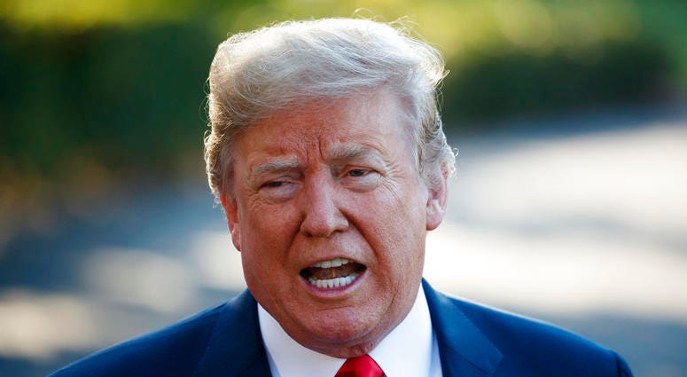 President Donald Trump speaks with reporters before boarding Marine One on the South Lawn of the White House, Tuesday DO NOT USE