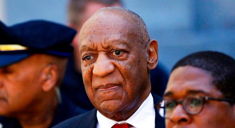 Bill Cosby, center, leaves the the Montgomery County Courthouse in Norristown, Pa. DO NOT USE