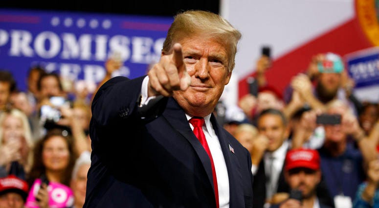 President Donald Trump arrives for a campaign rally at Florida State Fairgrounds Expo Hall, Tuesday, July 31, 2018, in Tampa, Fla. DO NOT USE