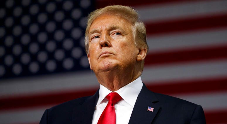 President Donald Trump listens during a campaign rally at Florida State Fairgrounds Expo Hall, Tuesday, July 31, 2018, in Tampa, Fla. DO NOT USE