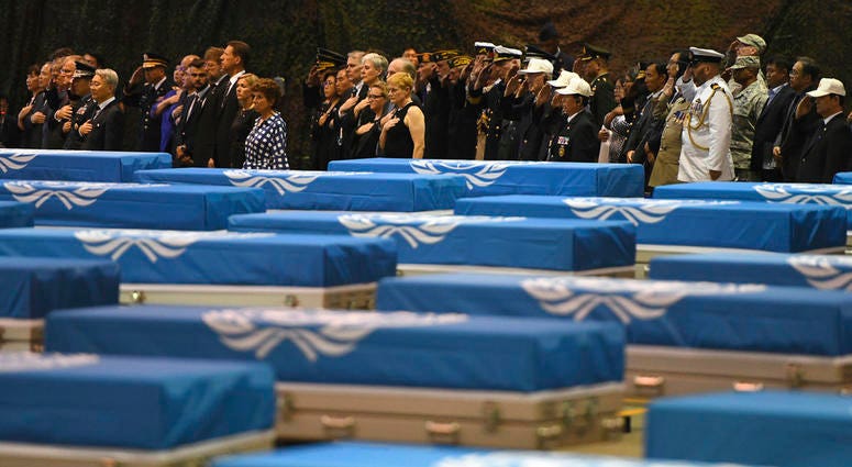 Attendees salute during a repatriation ceremony for the remains of U.S. soldiers who were killed in the Korean War and collected in North Korea, at the Osan Air Base in Pyeongtaek, South Korea, DO NOT USE