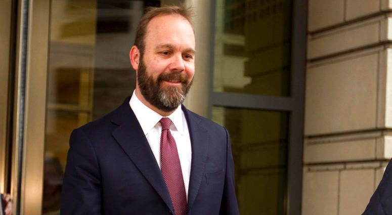 In this Feb. 23, 2018, file photo, Rick Gates leaves federal court in Washington. DO NOT USE