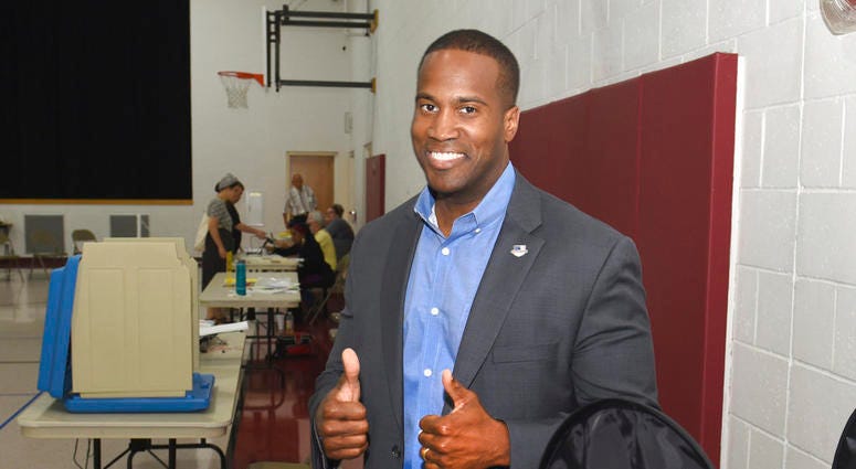 Michigan U.S. Senate candidate John James gives a thumbs up after casting his ballot on Tuesday, Aug. 7, 2018 at Orchard United Methodist Church in Farmington Hills, Mich. DO NOT USE