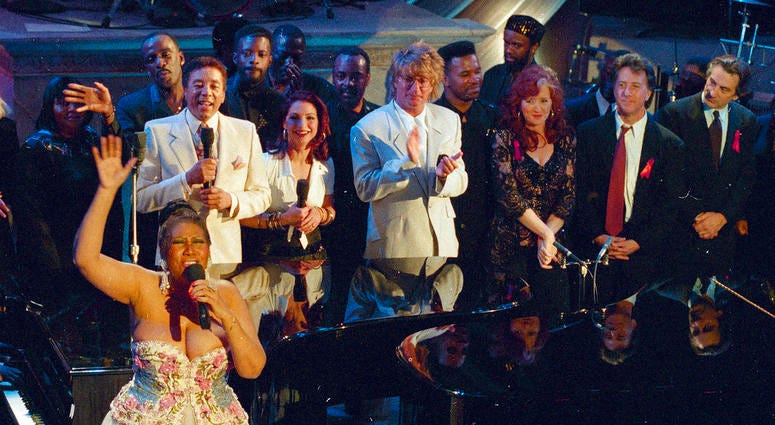 993 file photo, Aretha Franklin, foreground left, performs in the finale of "Aretha Franklin: Duets," an AIDS benefit concert for the Gay Men's Health Crisis in New York DO NOT USE