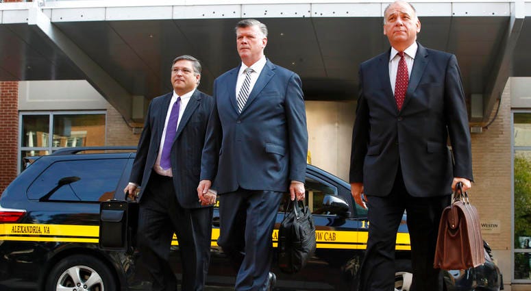 Defense attorneys Richard Westling, left, Kevin Downing, and Thomas Zehnle, walk to federal court as jury deliberations begin in the trial of former Trump campaign chairman Paul Manafort, in Alexandria, Va., Thursday, Aug. 16, 2018. DO NOT USE