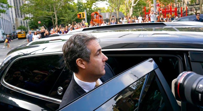 Michael Cohen, former personal lawyer to President Donald Trump, leaves federal court after reaching a plea agreement in New York