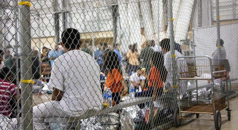 In this June 17, 2018 file photo provided by U.S. Customs and Border Protection, people who've been taken into custody related to cases of illegal entry into the United States DO NOT USE