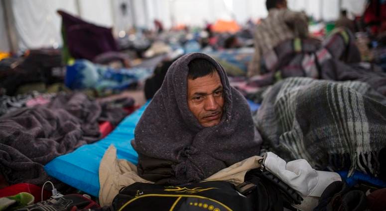 Alcides Padilla, from Honduras, wakes up at the Jesus Martinez stadium in Mexico City, DO NOT USE