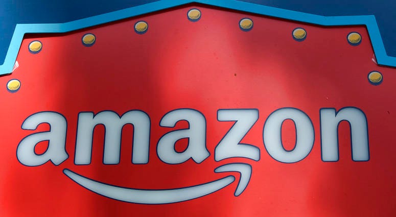 This Oct. 23, 2018, file photo shows an Amazon logo atop the Amazon Treasure Truck The Park DTLA office complex in downtown Los Angeles DO NOT USE