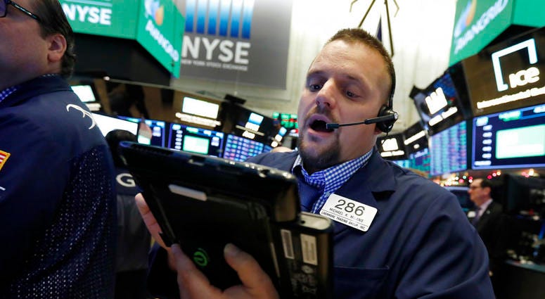 In this Nov. 28, 2018, file photo trader Michael Milano works on the floor of the New York Stock Exchange. The U.S. stock market opens at 9:30 a.m. EST on Tuesday, Dec. 4. DO NOT USE