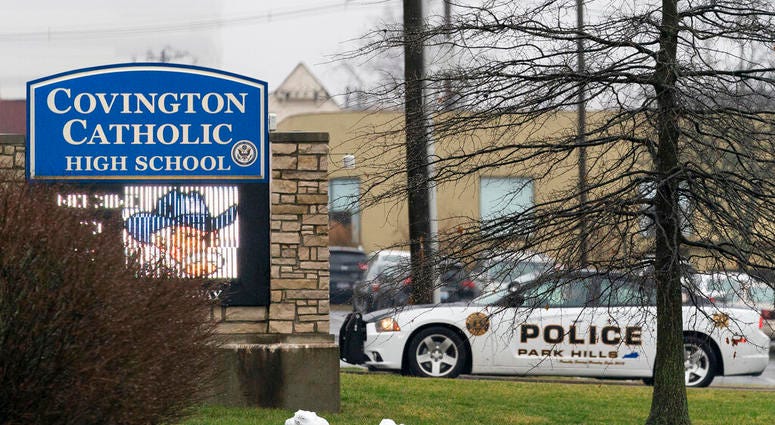 A police car sits at the entrance to Covington Catholic High School in Park Hills, Ky AP DO NOT USE