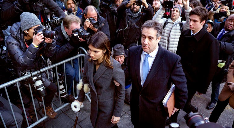 Michael Cohen, center, President Donald Trump's former lawyer, accompanied by his children Samantha, left, and Jake, right, arrives at federal court for his sentencing in New York. Michael Cohen, center, President Donald Trump's former lawyer, accompanied by his children Samantha, left, and Jake, right, arrives at federal court for his sentencing in New York.