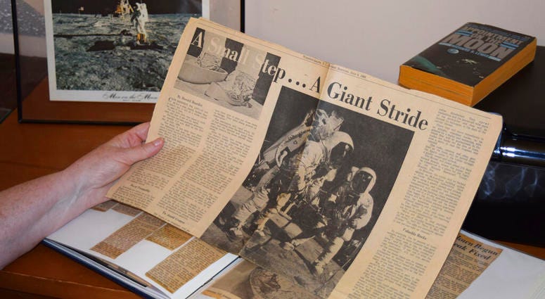 Cathy Goff shows her with newspaper clippings about the Apollo 11 moon landing mission at her home in King, N.C Cathy Goff shows her with newspaper clippings about the Apollo 11 moon landing mission at her home in King, N.C