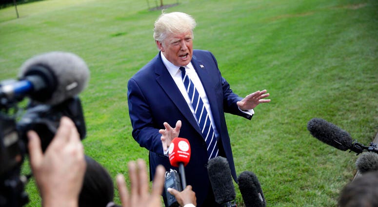 President Donald Trump speaks to members of the media before boarding Marine One helicopter on the South Lawn of the White House in Washington, for the short flight to nearby Andrews Air Force Base, Md., Friday, July 19, 2019. AP DO NOT USE