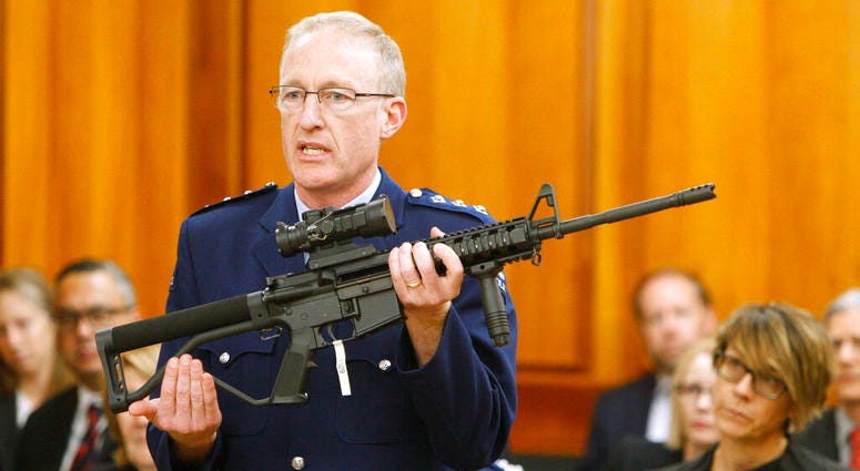 police acting superintendent Mike McIlraith shows New Zealand lawmakers an AR-15 style rifle AP DO NOT USE