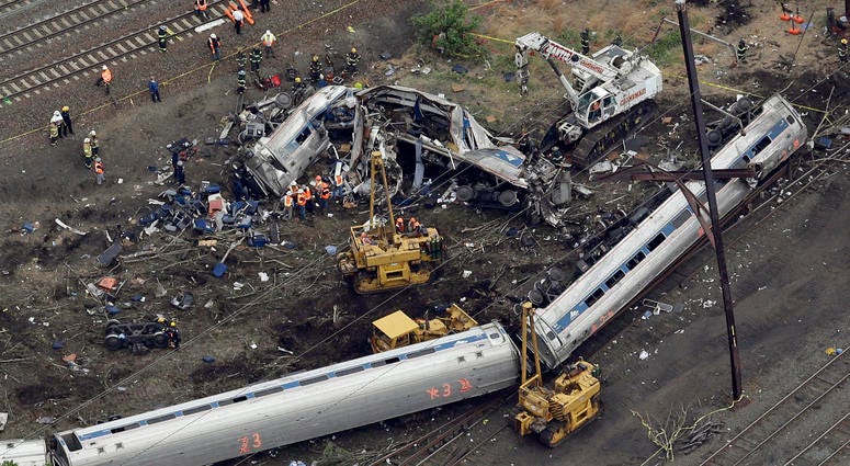 A New York City-bound Amtrak passenger train following a derailment that killed eight people and injured about 200 others in Philadelphia. A New York City-bound Amtrak passenger train following a derailment that killed eight people and injured about 200 others in Philadelphia.