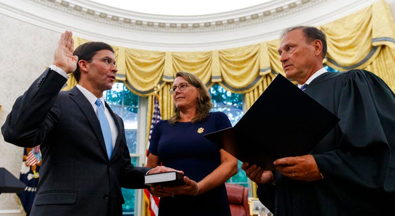 Mark Esper, left, is sworn in as the Secretary of Defense by Supreme Court Justice Samuel Alito, right Mark Esper, left, is sworn in as the Secretary of Defense by Supreme Court Justice Samuel Alito, right