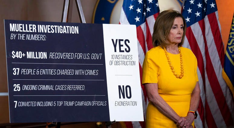 Speaker of the House Nancy Pelosi, D-Calif., stands beside a chart during a newss conference following the back-to-back hearings with former special counsel Robert Mueller AP DO NOT USE
