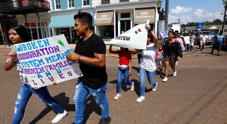 children of mainly Latino immigrant parents hold signs in support of them children of mainly Latino immigrant parents hold signs in support of them