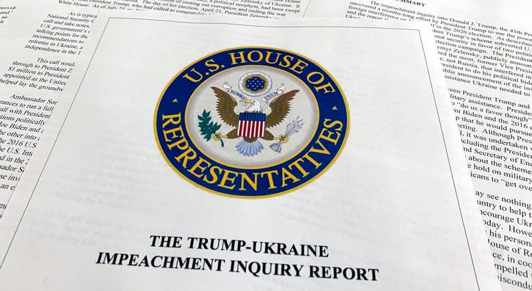 The report from Democrats on the House Intelligence Committee on the impeachment inquiry into President Donald Trump is photographed in Washington, Tuesday, Dec. 3, 2019. The House released a sweeping impeachment report outlining evidence of what it calls The report from Democrats on the House Intelligence Committee on the impeachment inquiry into President Donald Trump is photographed in Washington, Tuesday, Dec. 3, 2019. The House released a sweeping impeachment report outlining evidence of what it calls