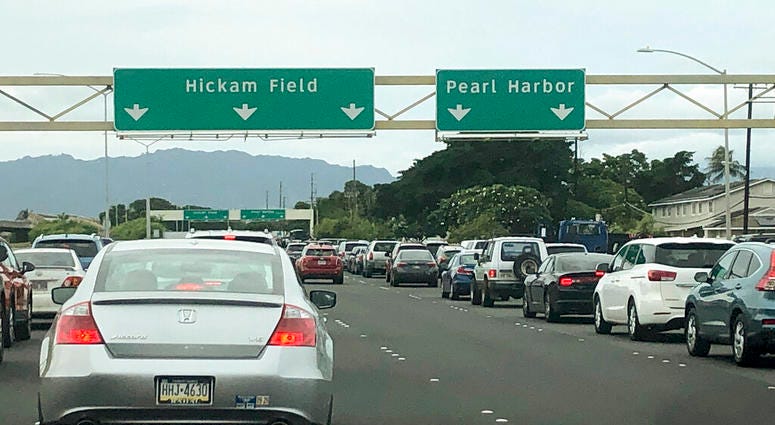 Traffic backs up at the main gates after a shooting at Pearl Harbor Naval shipyard, Wednesday, Dec. 4, 2019, near Pearl Harbor in Honolulu. Traffic backs up at the main gates after a shooting at Pearl Harbor Naval shipyard, Wednesday, Dec. 4, 2019, near Pearl Harbor in Honolulu.